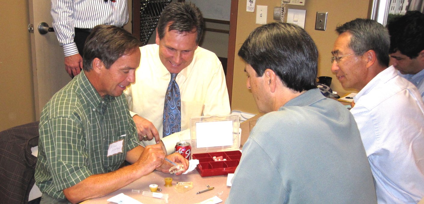 Dr. Stout meeting with area dentists to provide continuing education on advanced implant techniques.